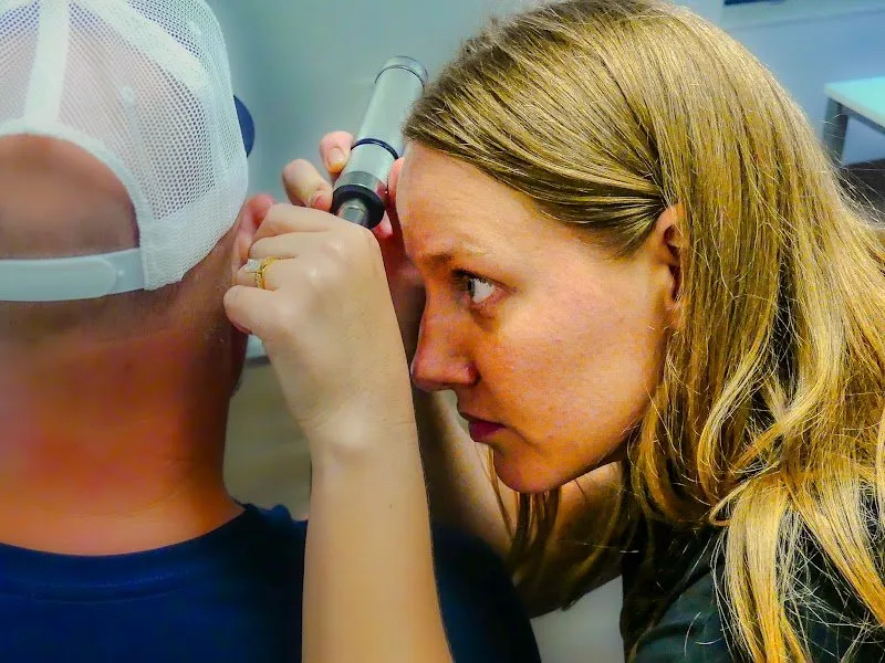 Dr. Joy Hooter performing an otoscopic ear examination at Hooter Hearing