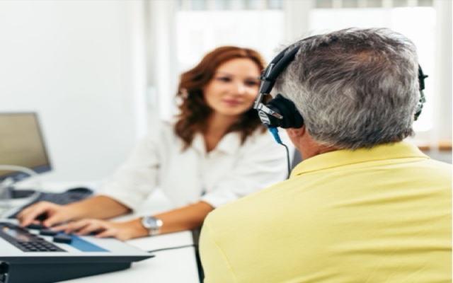 Patient undergoing a hearing test with headphones